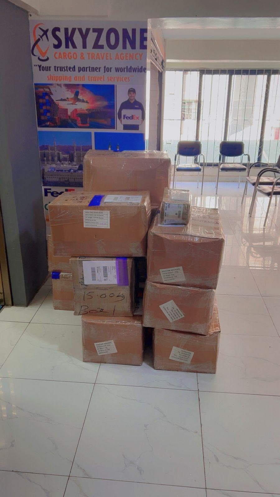 Shipments ready for dispatch under the Skyzone Cargo & Travel banner at the Hodo Souk office